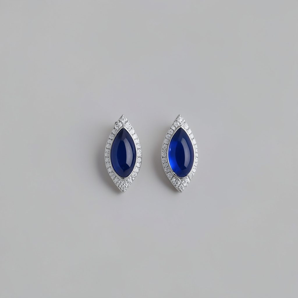 Atmospheric product photograph of earrings on a neutral background